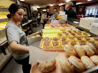 1008020024 ma nb MasDonuts  Paige Raposa, fills a glazed donut order at Ma's Donuts on Acushnet Avenue in the north end of New Bedford.   PETER PEREIRA : food, restaurant, eat, morning, breakfast, work, labor